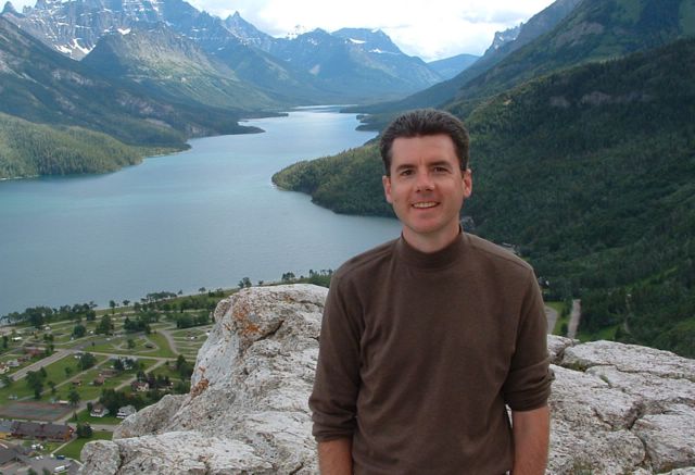 John Hunter with lake and mountains in the background