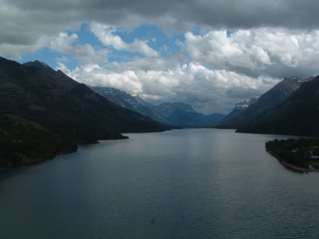 view of large lake, mountains and clouds